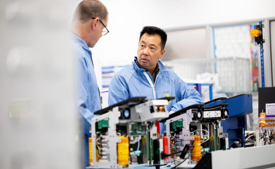 Employees Working With Electronics