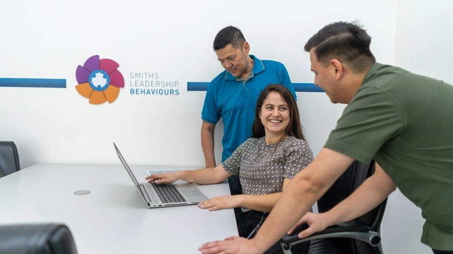 Graduates Working At Laptop