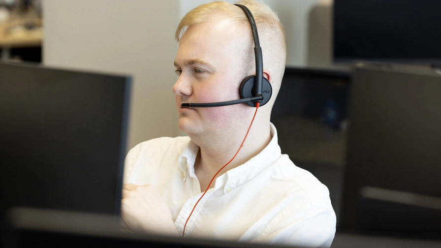 Rhys At Desk With Headset On