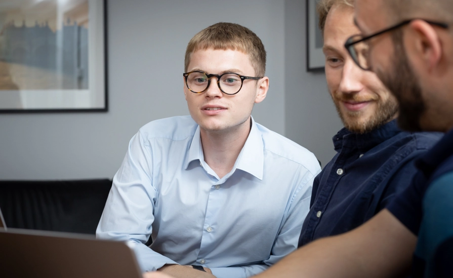 Three People Looking At Screen